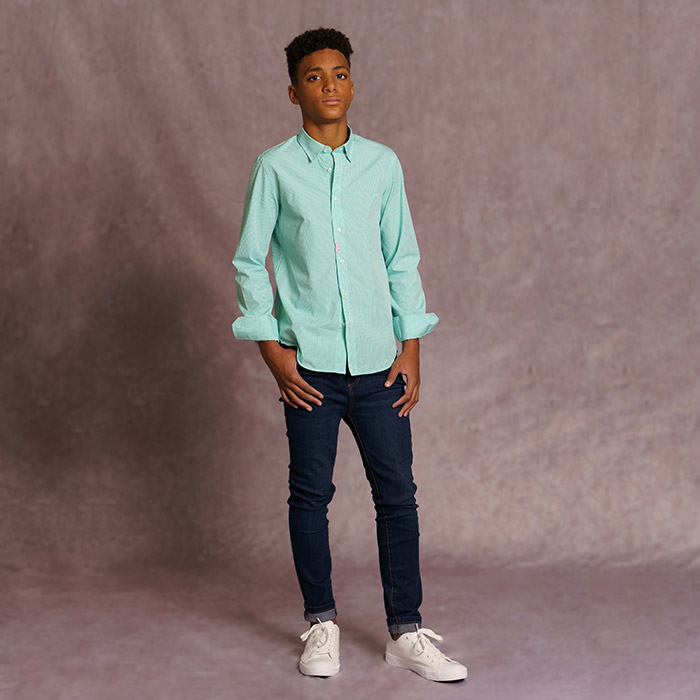 Complete look for boys 12 to 14 years old with MasaiMan green shirt and jeans.